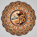 Decorative wall art with cowboy boots and sunflowers on a brown background