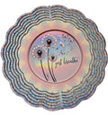 Decorative plate with dandelion design and 'just breathe' text on a colorful background